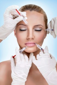 Young woman getting cosmetic injectables into her face