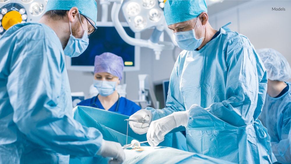 Plastic surgeons working on a patient in the operating room.