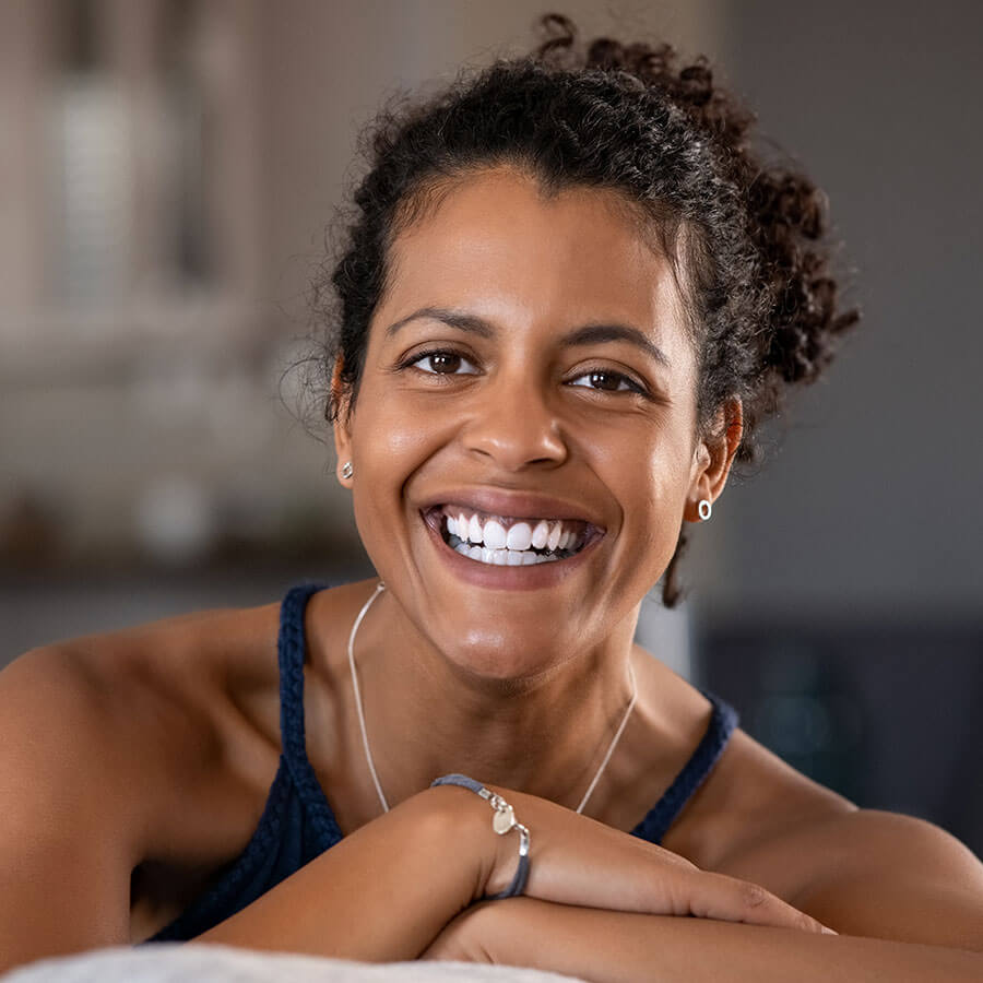 Woman with curly hair smiling